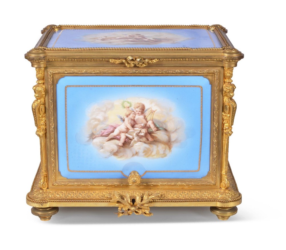 A 19th-century French ormolu and light blue porcelain decanter box open to display glass decanters and matching glasses. View II