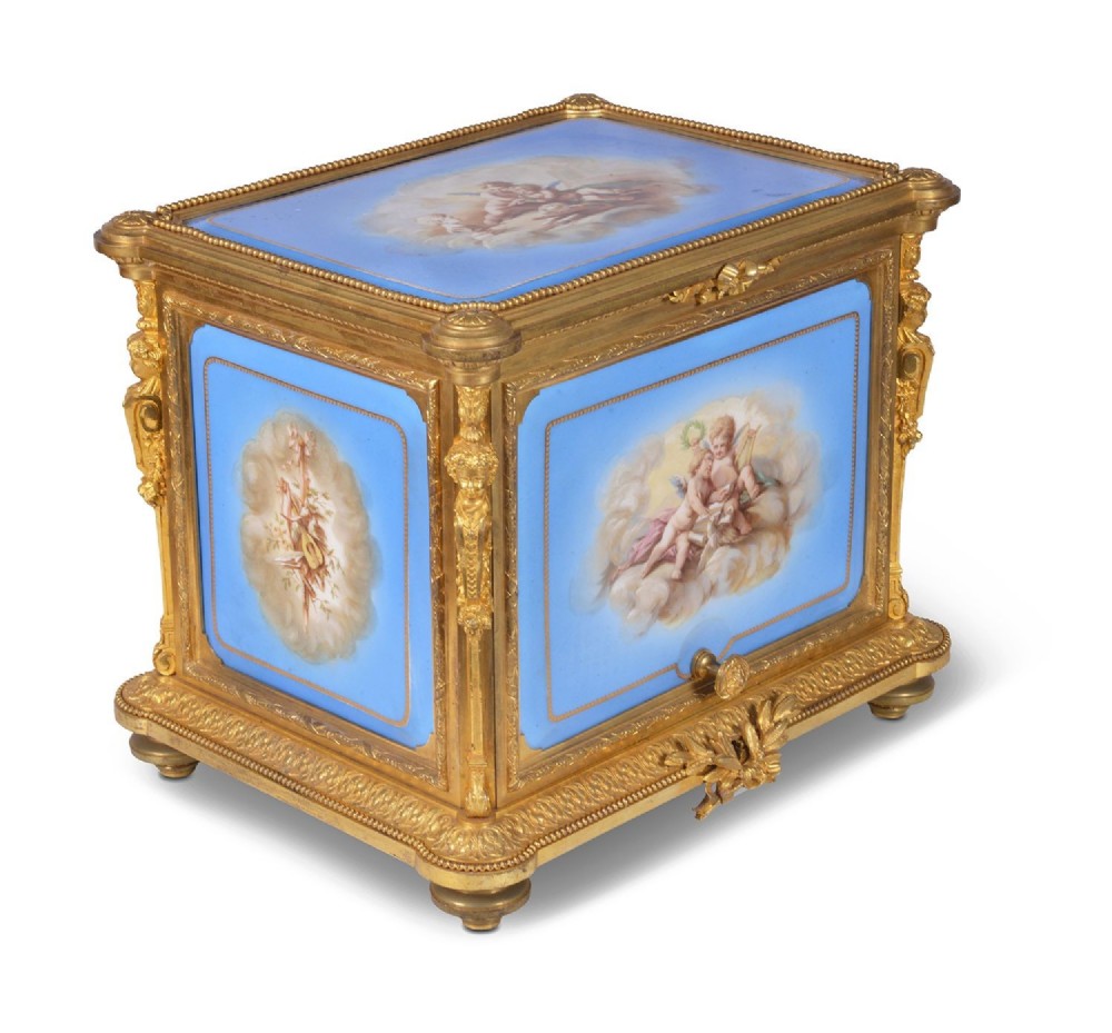 A 19th-century French ormolu and light blue porcelain decanter box open to display glass decanters and matching glasses. View III