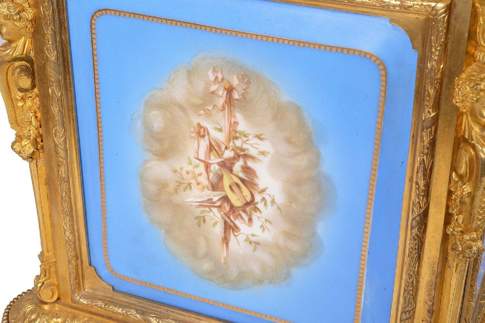 A 19th-century French ormolu and light blue porcelain decanter box open to display glass decanters and matching glasses. View V