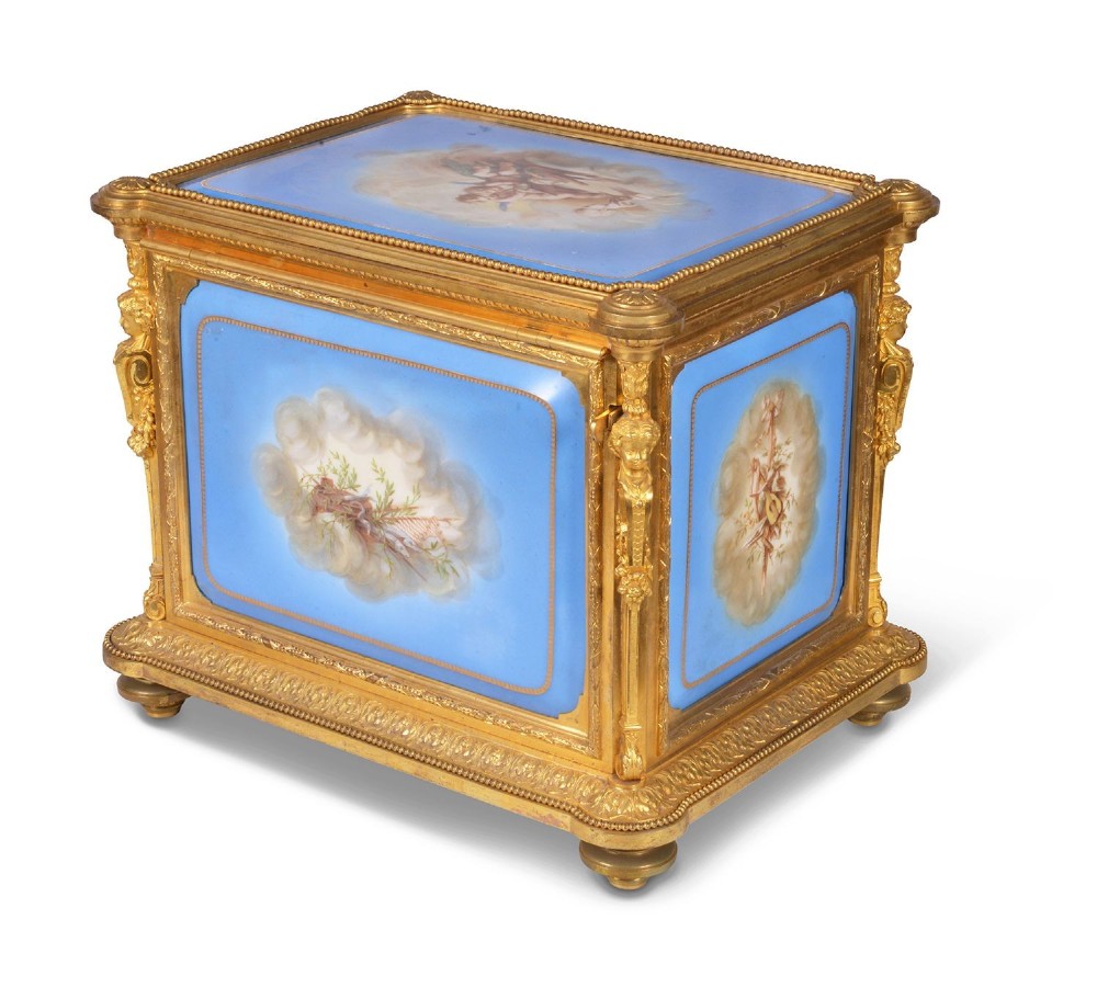 A 19th-century French ormolu and light blue porcelain decanter box open to display glass decanters and matching glasses. View VII