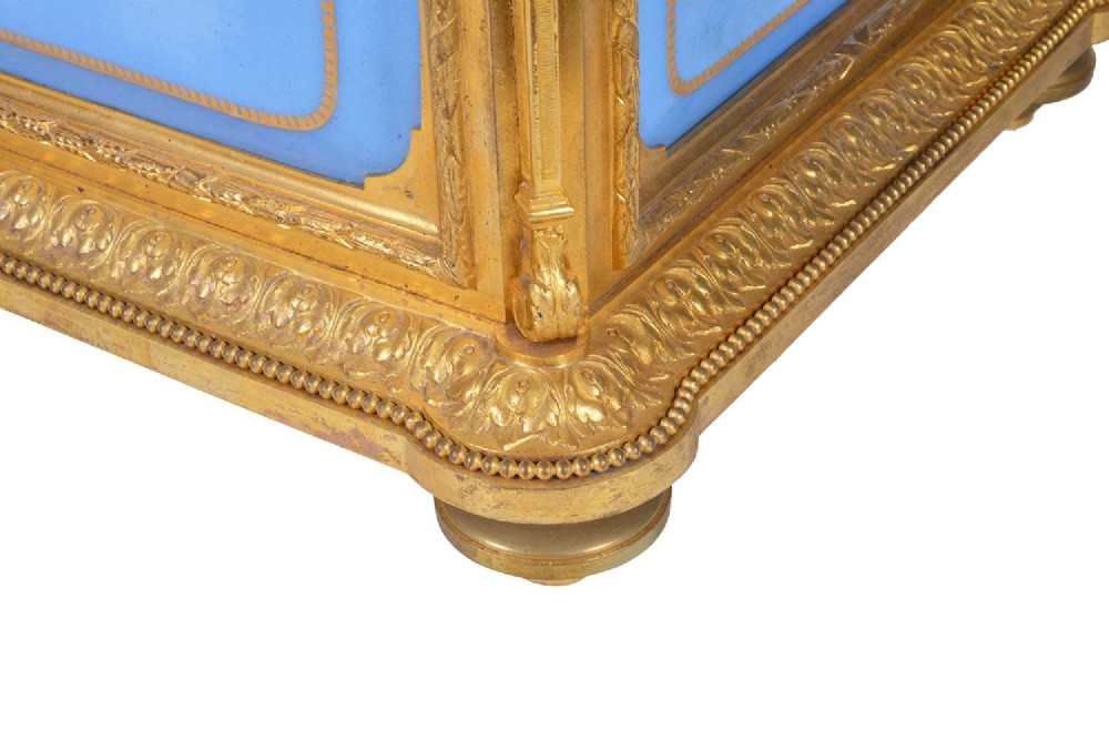 A 19th-century French ormolu and light blue porcelain decanter box open to display glass decanters and matching glasses. View IX