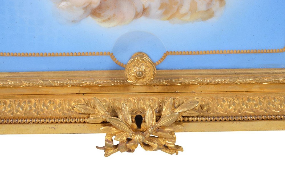 A 19th-century French ormolu and light blue porcelain decanter box open to display glass decanters and matching glasses. View X
