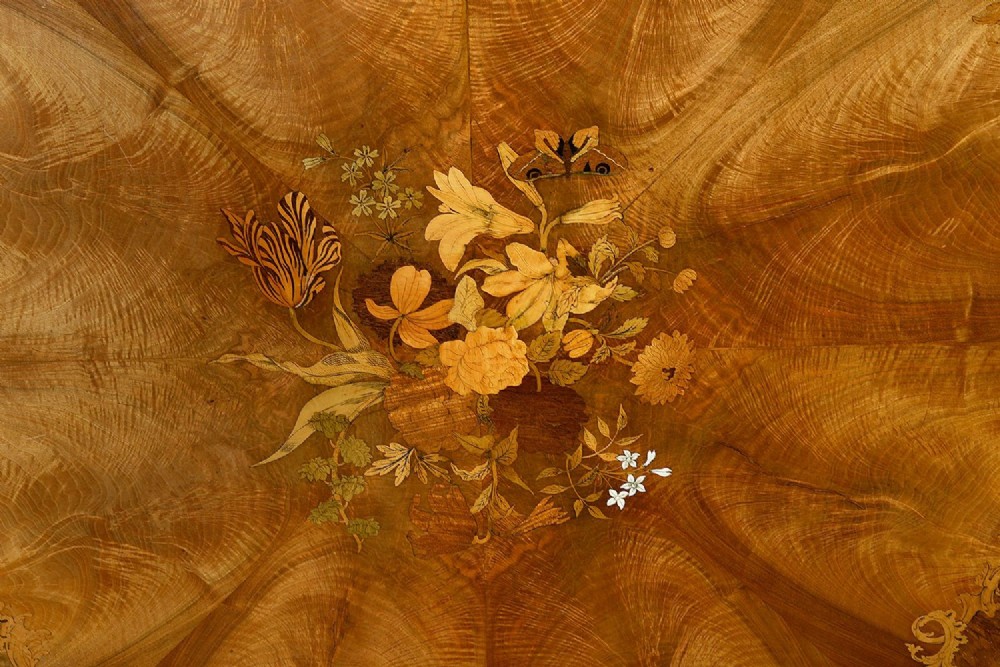 A circular Victorian walnut centre table featuring radial segment veneers, intricate floral marquetry, and a carved pedestal base with scroll feet. View III