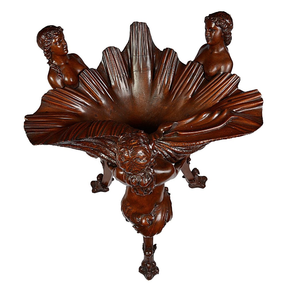 An 18th-century style carved walnut jardiniere featuring three mythical figures supporting a large shell basin on a tripod base. View VIII