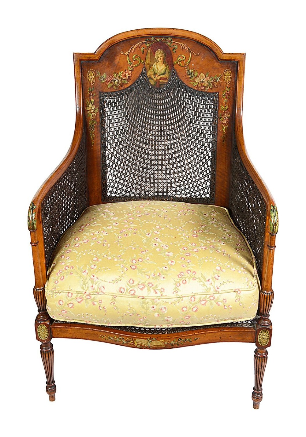 A pair of late Victorian Sheraton Revival satinwood bergere armchairs featuring hand-painted floral motifs, portrait medallions, caned backs, and yellow fabric seats. View III