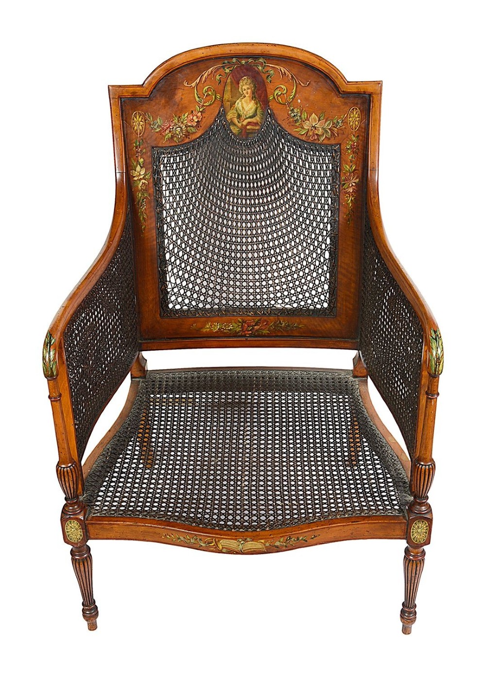A pair of late Victorian Sheraton Revival satinwood bergere armchairs featuring hand-painted floral motifs, portrait medallions, caned backs, and yellow fabric seats. View IV