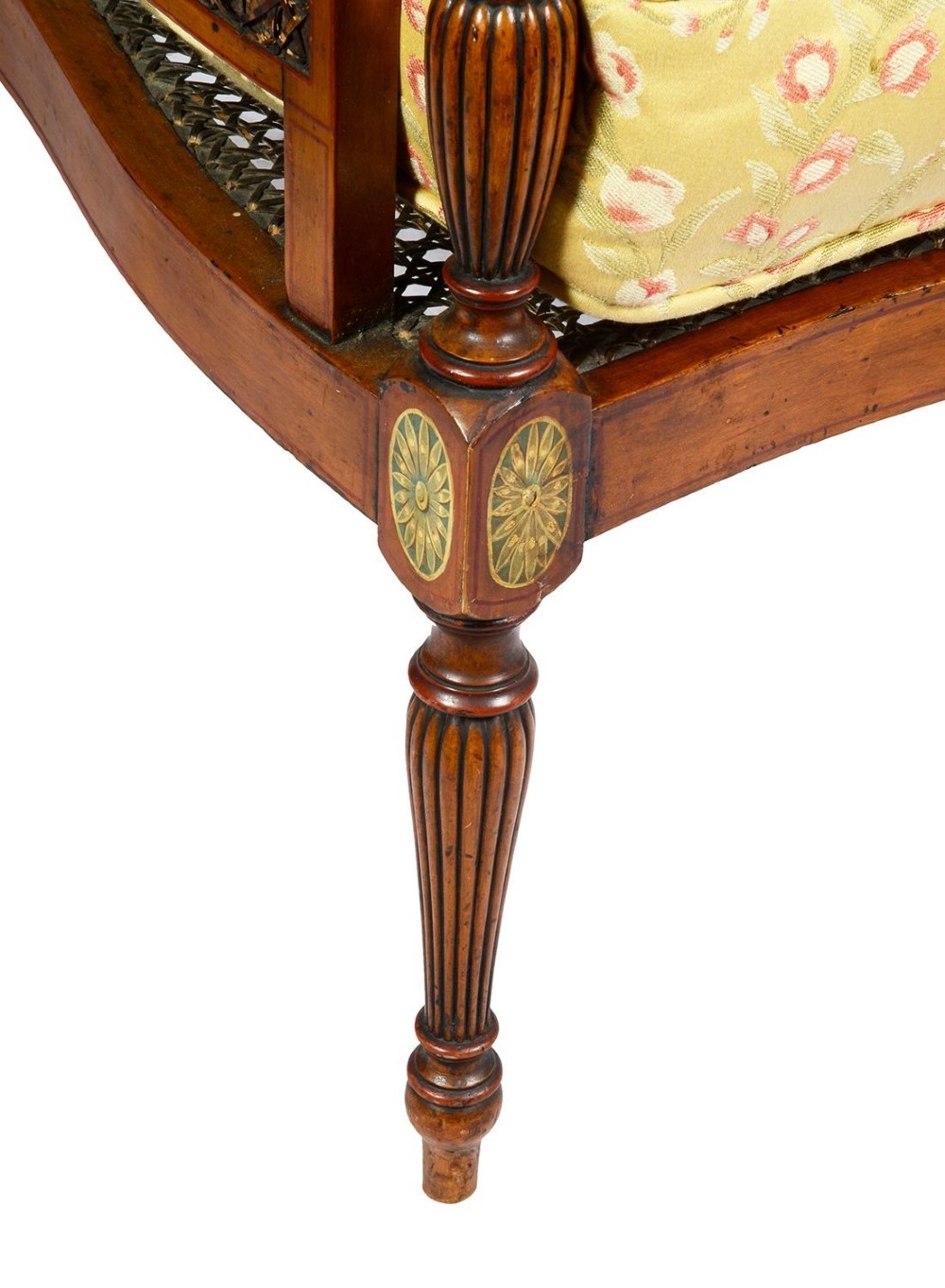 A pair of late Victorian Sheraton Revival satinwood bergere armchairs featuring hand-painted floral motifs, portrait medallions, caned backs, and yellow fabric seats. View VII