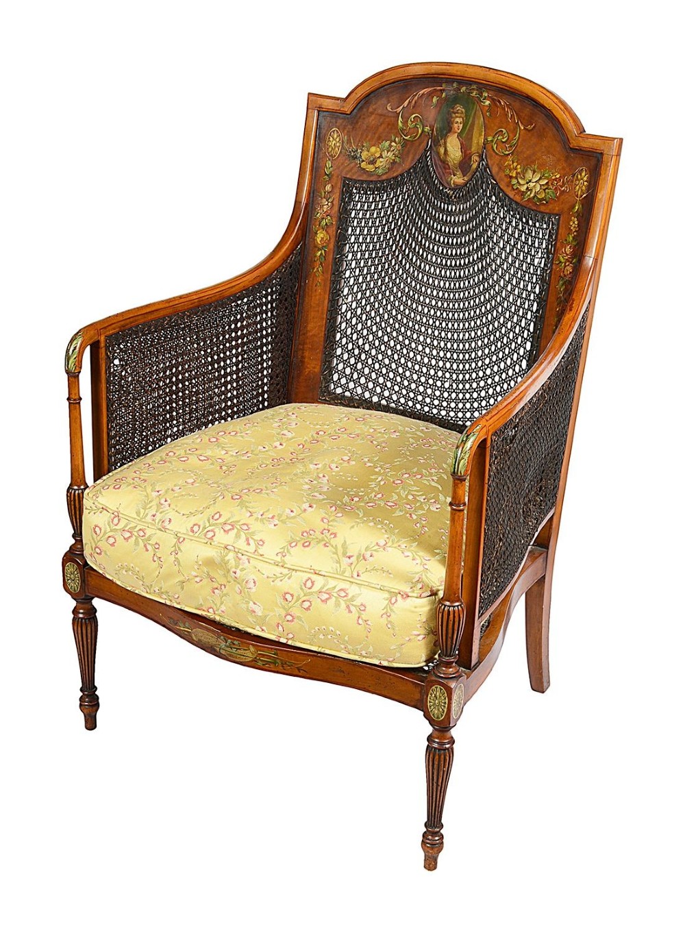 A pair of late Victorian Sheraton Revival satinwood bergere armchairs featuring hand-painted floral motifs, portrait medallions, caned backs, and yellow fabric seats. View XI