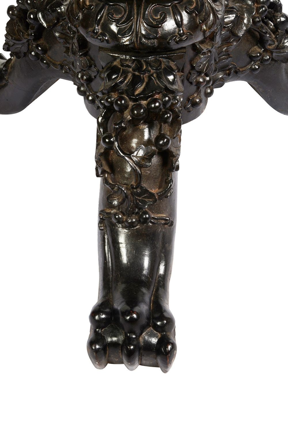 A nineteenth-century Chinese carved dark hardwood side table featuring a circular pink marble inset top, pierced openwork frieze, reticulated central pedestal, and tripod clawed feet. View VI