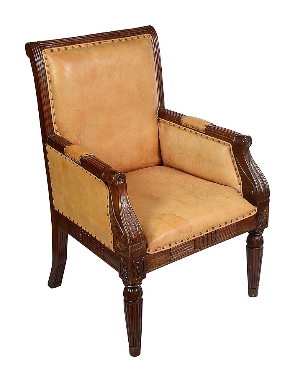 A pair of Regency style dark mahogany library armchairs upholstered in tan leather with brass stud trimming and reeded carved legs. View III