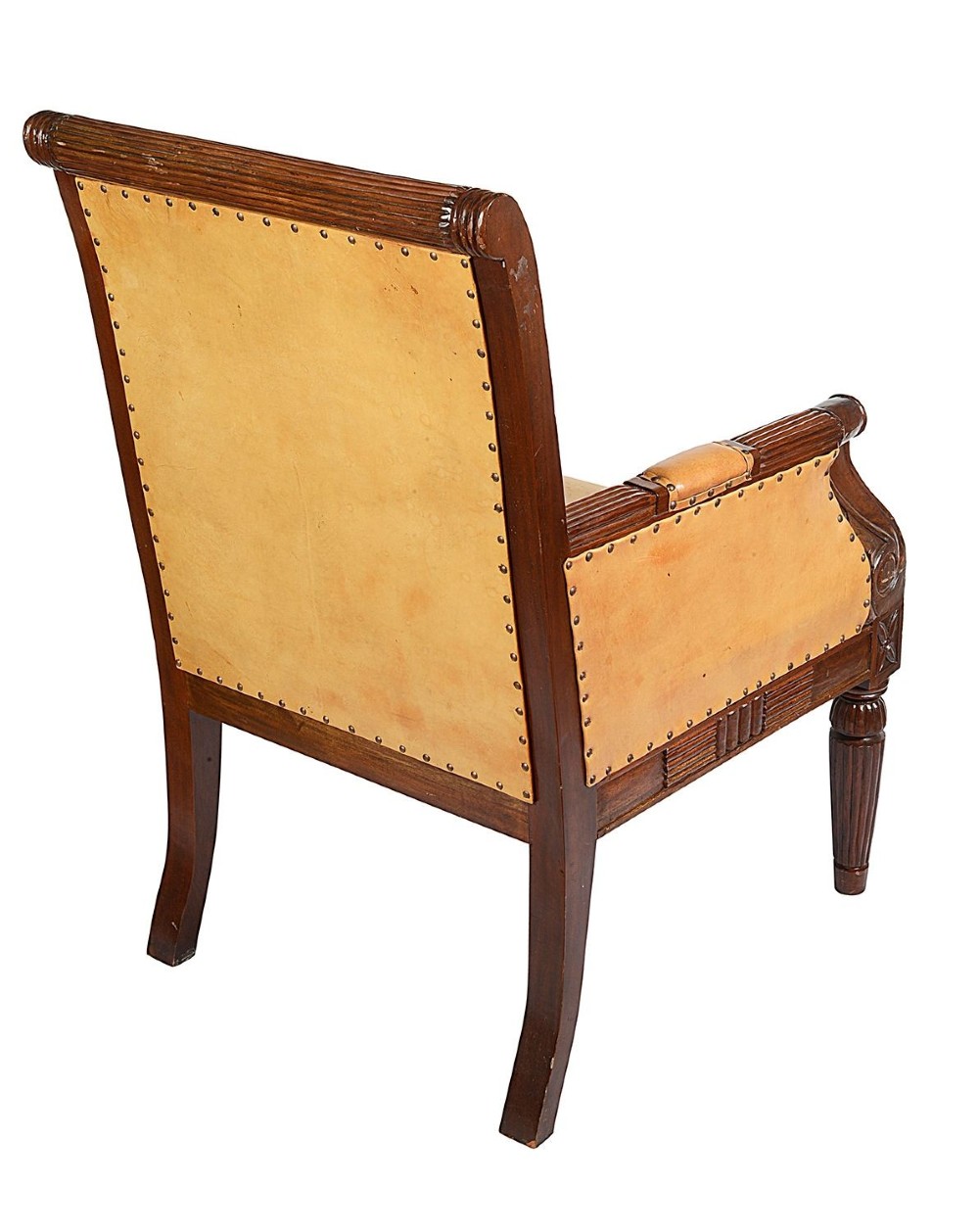 A pair of Regency style dark mahogany library armchairs upholstered in tan leather with brass stud trimming and reeded carved legs. View VII