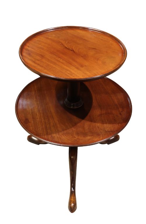 fig 1. A Georgian two-tier mahogany etagere featuring circular trays supported by a turned central column and a tripod base with cabriole legs.