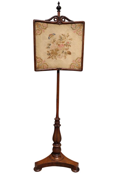 fig 1. A Regency rosewood pole screen featuring an adjustable square needlework panel with floral motifs mounted on a turned column and triform base.