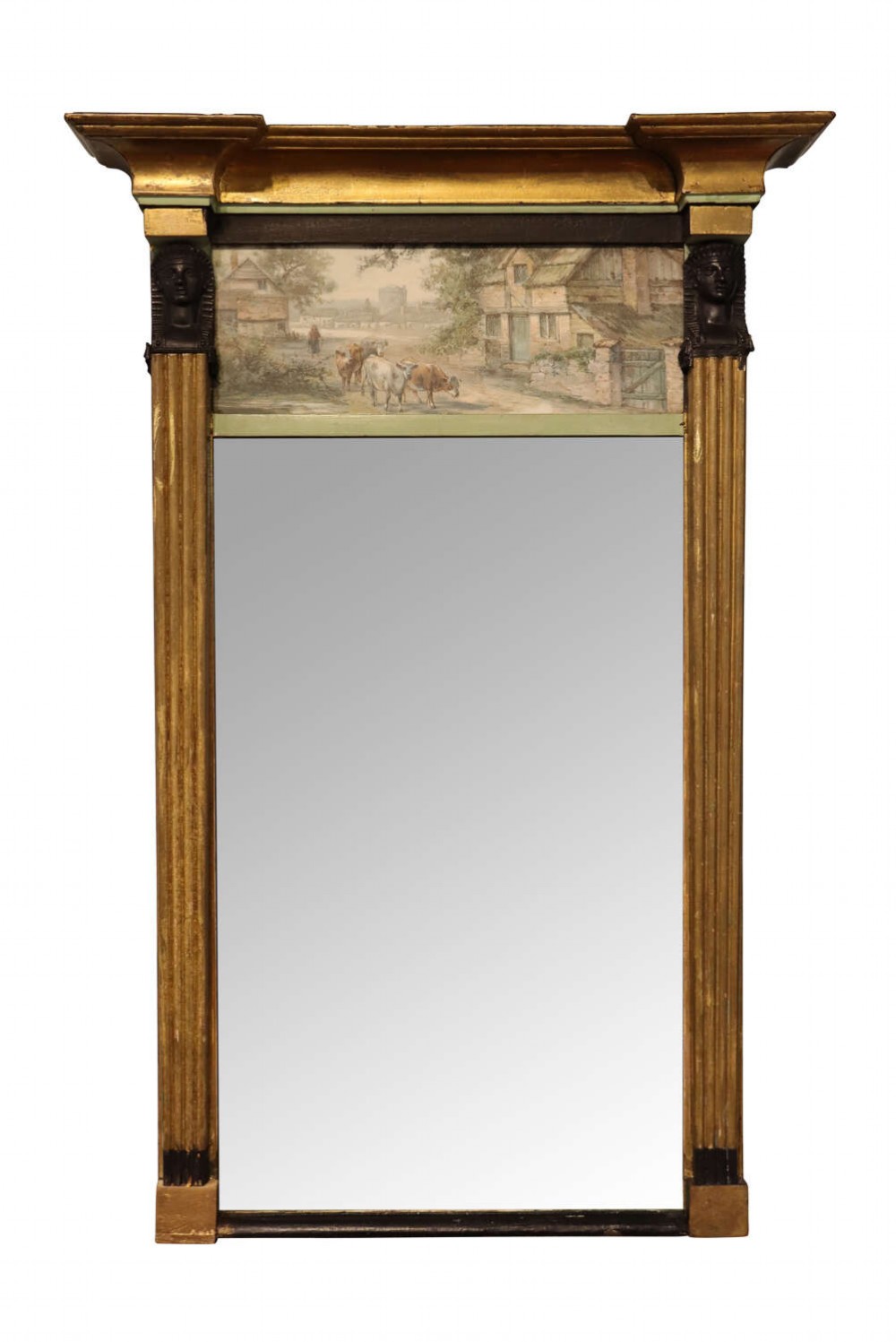 A French Empire trumeau wall mirror featuring a gilded architectural frame with fluted pilasters and a painted landscape panel above rectangular glass.