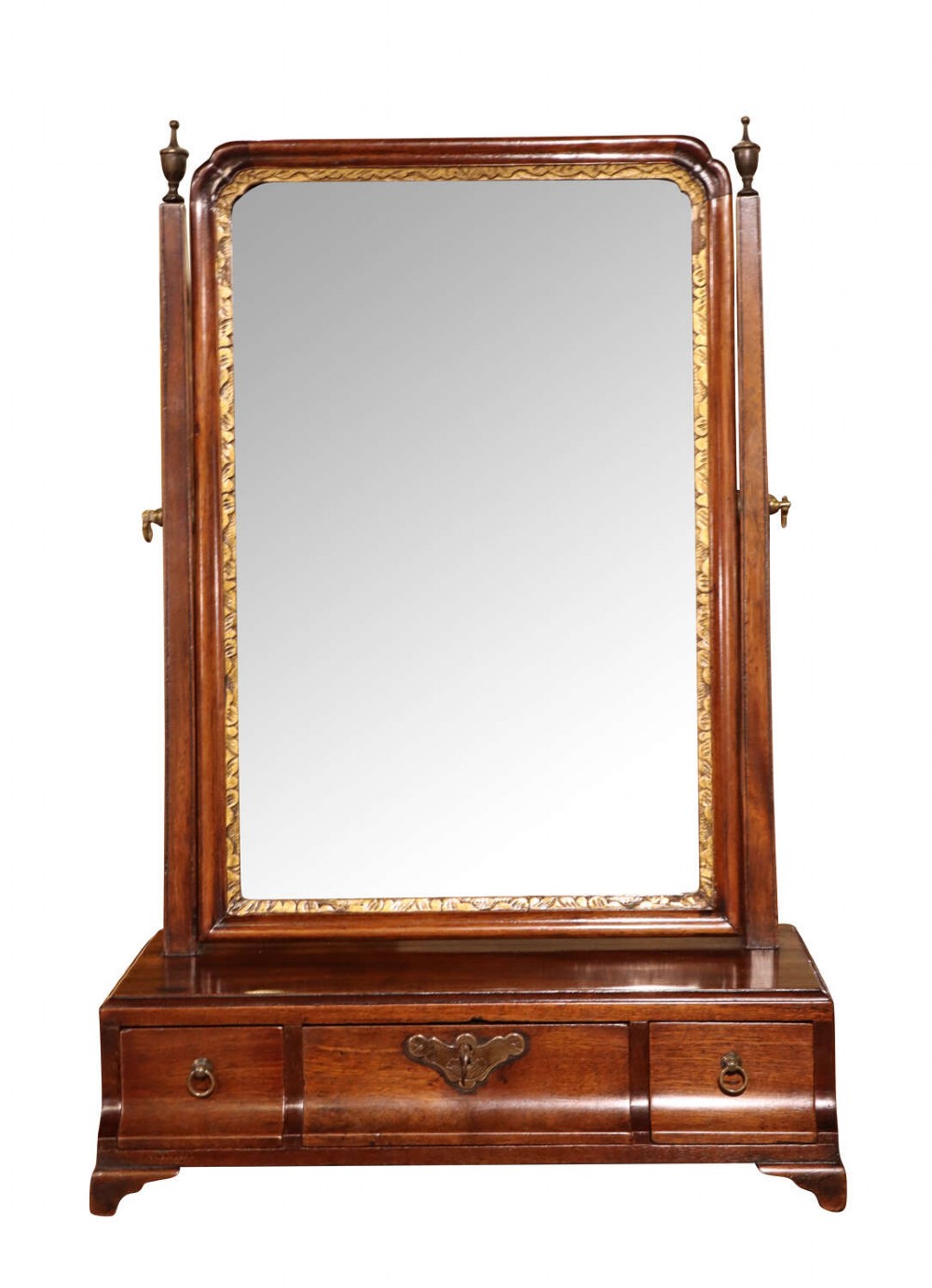 An antique Victorian dark mahogany toilet mirror featuring a rectangular frame with a gilt inner slip, turned side columns with finials, and a three-drawer plinth base.