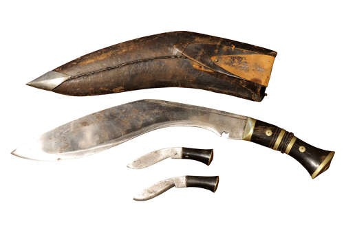 An early 20th-century Nepalese kukri dagger housed in a dark leather scabbard featuring a carved horn handle and two small companion knives. View II