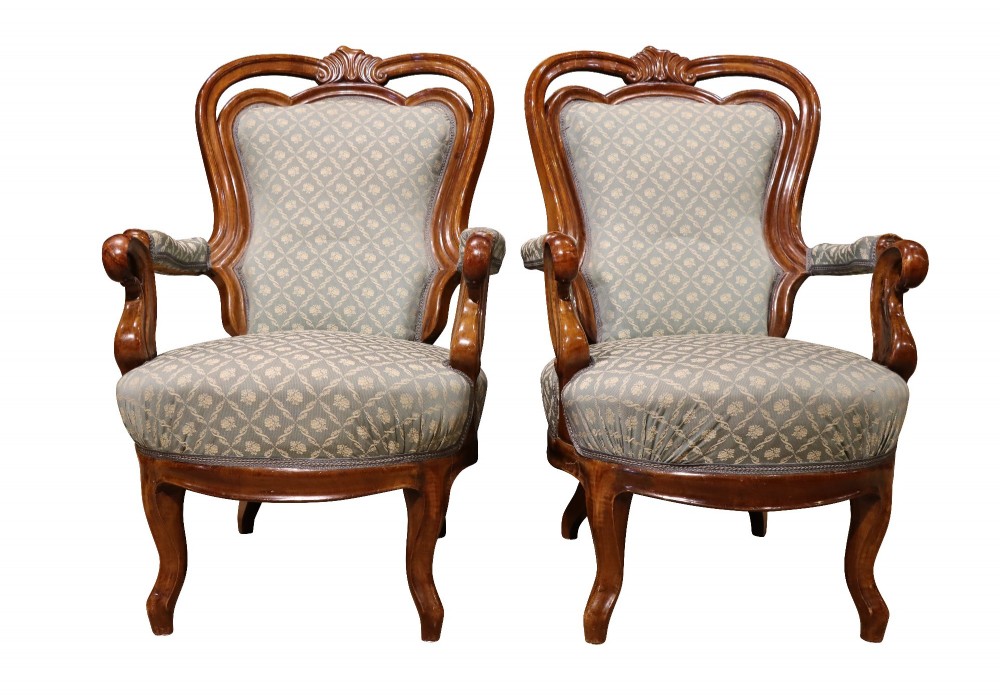 A late 19th-century three-piece walnut salon suite featuring a central settee and two matching armchairs upholstered in patterned sage green fabric with carved serpentine frames. View VIII