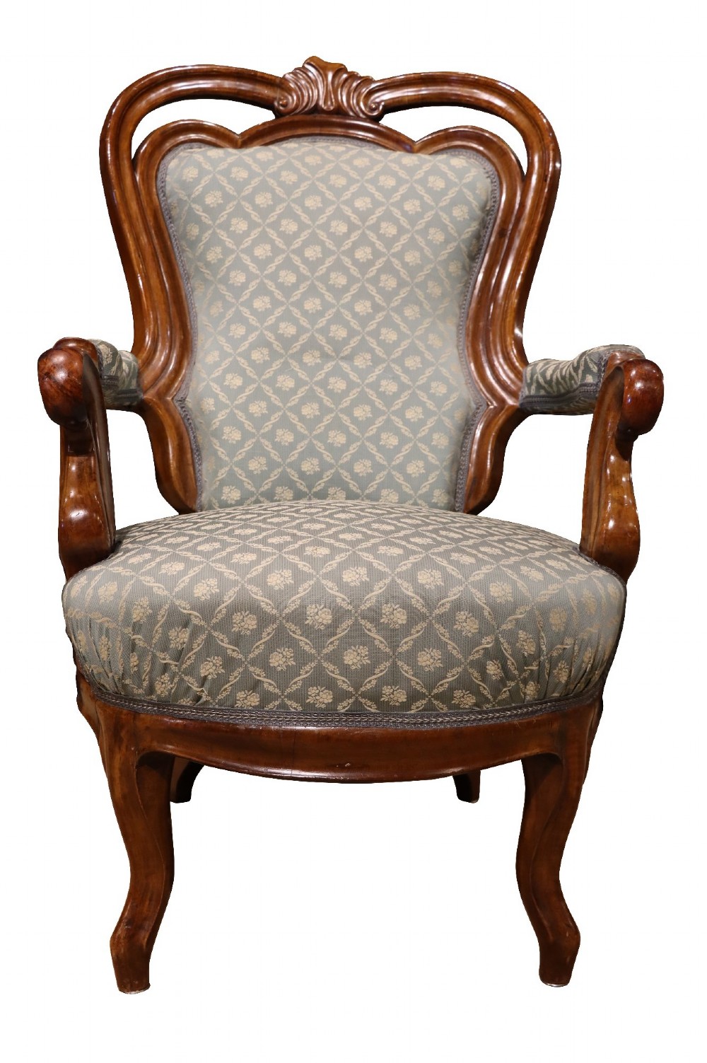 A late 19th-century three-piece walnut salon suite featuring a central settee and two matching armchairs upholstered in patterned sage green fabric with carved serpentine frames. View X