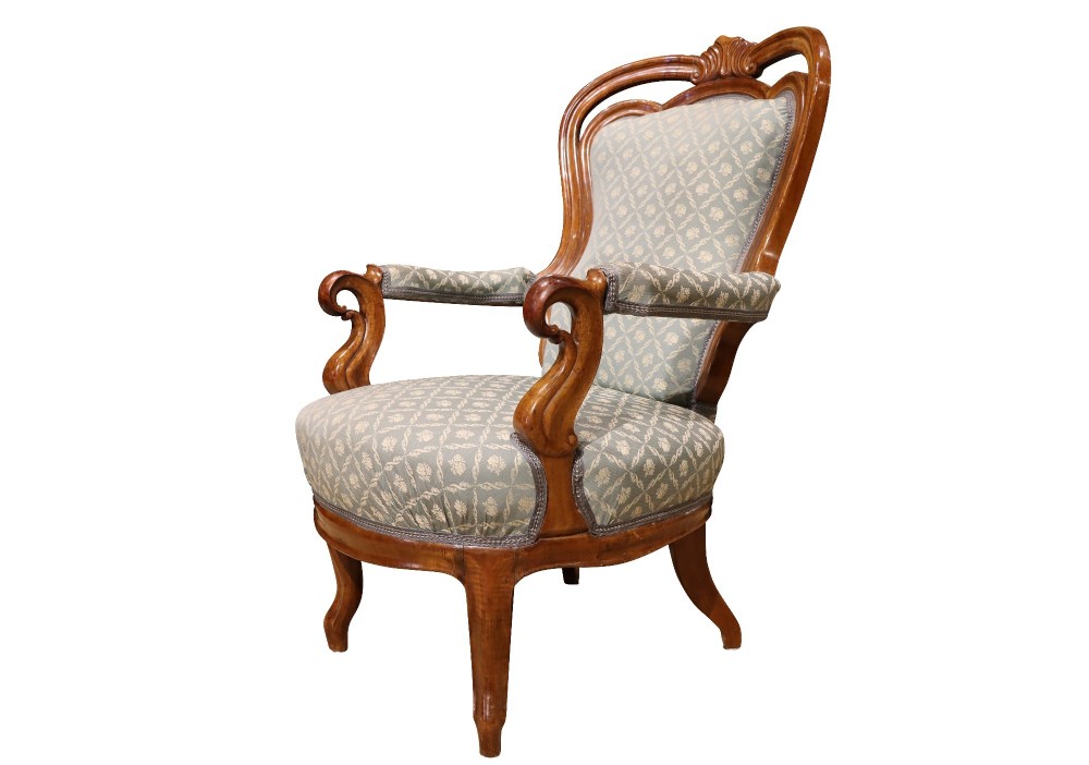 A late 19th-century three-piece walnut salon suite featuring a central settee and two matching armchairs upholstered in patterned sage green fabric with carved serpentine frames. View XI