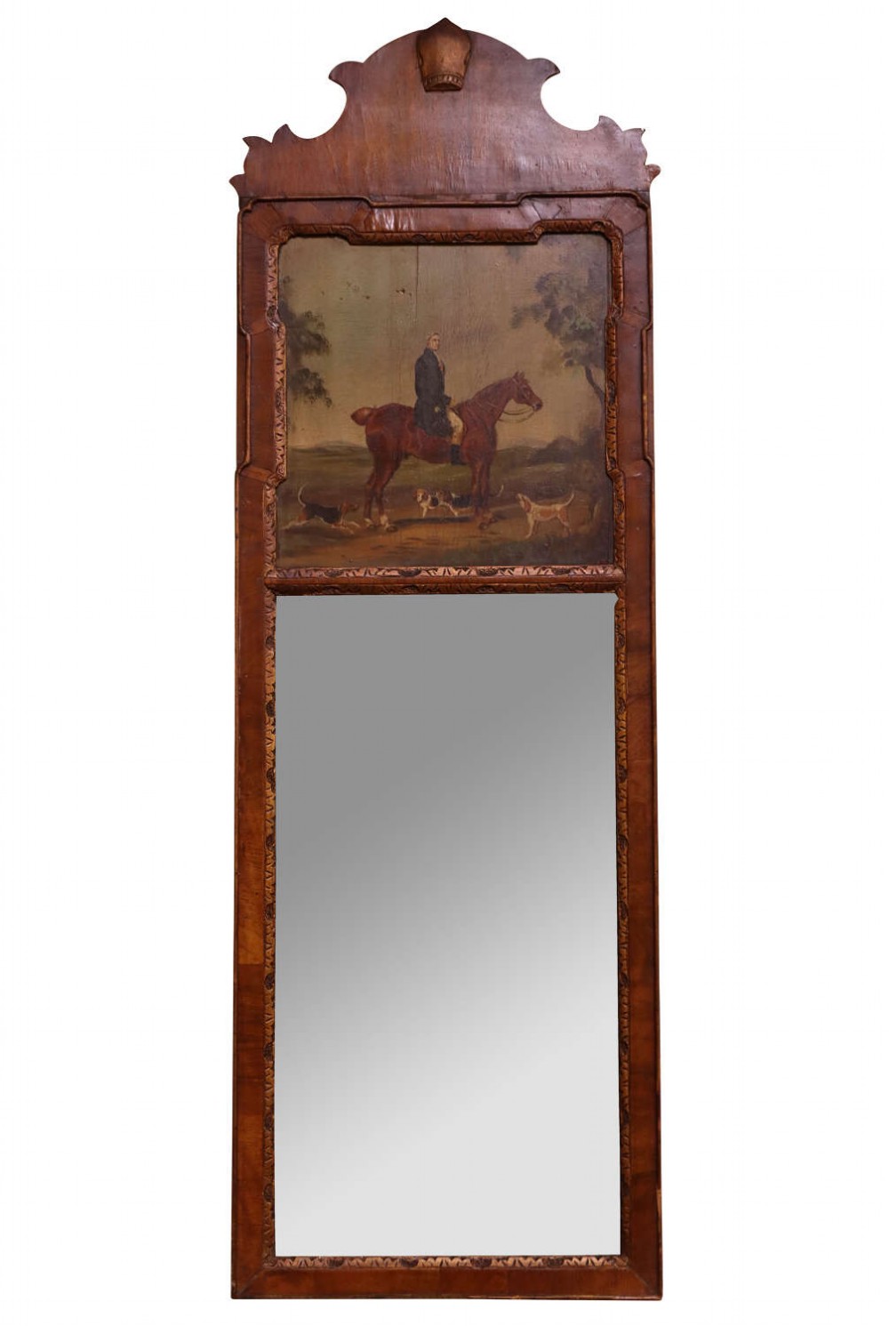 An early 20th-century Queen Anne Revival walnut pier glass mirror featuring a shaped cresting, an upper equestrian oil painting panel, and a tall mirrored pane below.