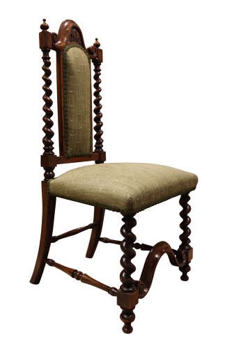 A Victorian walnut childs chair featuring spiralled barley twist uprights, a carved top crest, an upholstered green fabric seat and back, and a shaped front stretcher. View IV