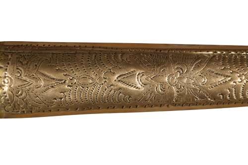 A 19th-century Malay keris featuring a wavy forged steel blade alongside a carved wooden hilt and an ornate brass-encased sheath. View IV