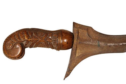 A 19th-century Malay keris featuring a wavy forged steel blade alongside a carved wooden hilt and an ornate brass-encased sheath. View VII