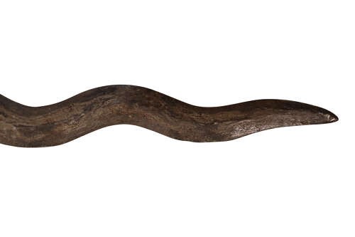 A 19th-century Malay keris featuring a wavy forged steel blade alongside a carved wooden hilt and an ornate brass-encased sheath. View VIII