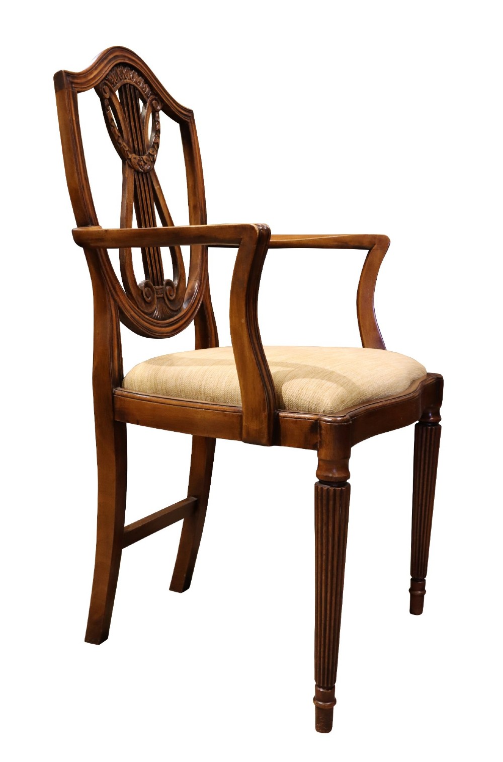 Set of mahogany dining chairs featuring shield-shaped backs with carved lyre motifs, fluted front legs, and neutral upholstered seats. View VII