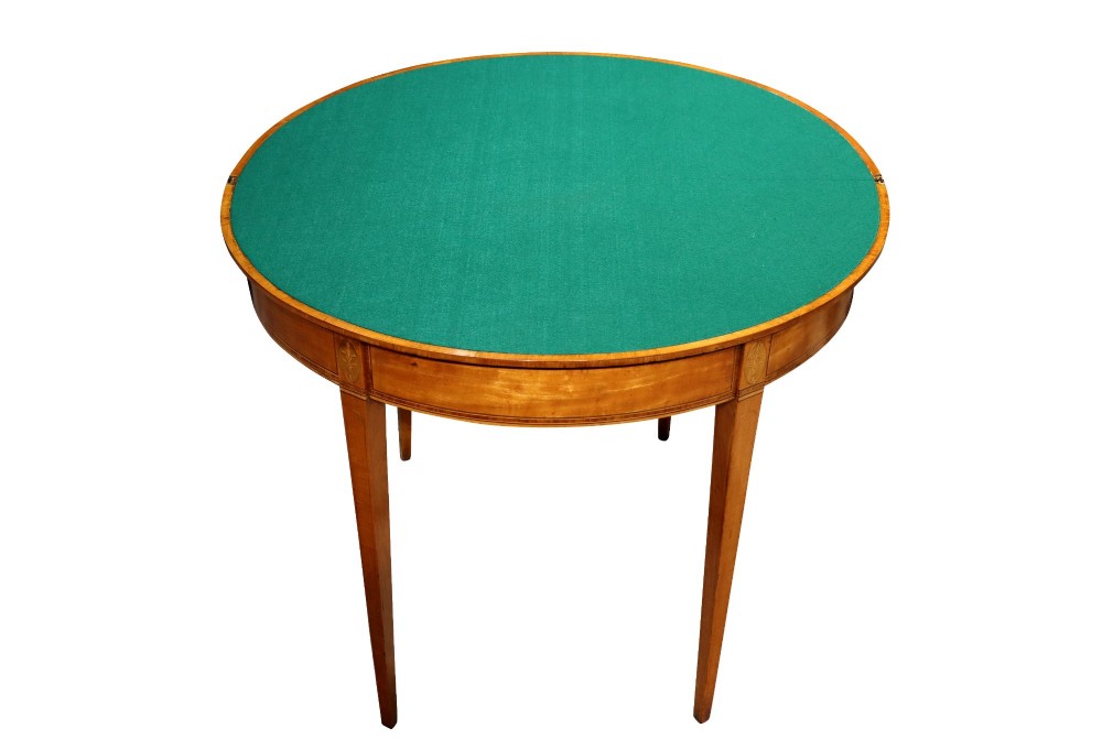 A George III satinwood demi-lune card table featuring kingwood crossbanding and square tapered legs. View V