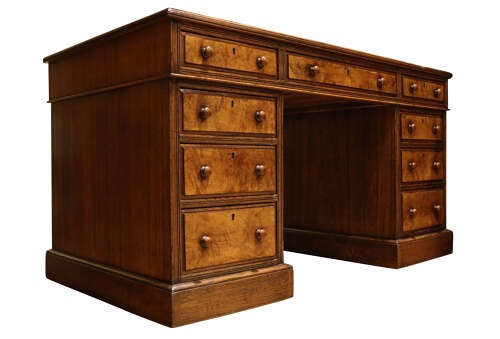 A Victorian oak and burr walnut pedestal desk featuring nine drawers with turned wooden knob handles and a central kneehole. View VI