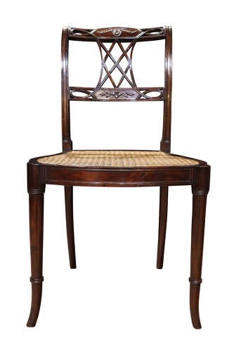 An Edwardian dark mahogany side chair featuring a woven cane seat, pierced lattice splat, and turned front legs. View II