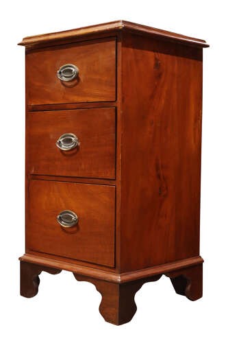 A pair of Victorian mahogany bedside chests featuring three drawers each, brass oval handles, and shaped bracket feet. View VI