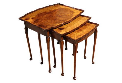 A set of three nested 1920s burr walnut side tables featuring shaped piecrust tops and slender cabriole legs. View IV
