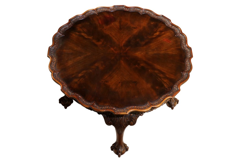 A low circular burr walnut occasional table featuring a scalloped piecrust rim, carved cabriole legs, and ball-and-claw feet. View II