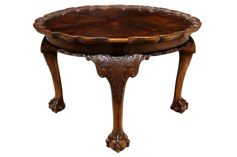 A low circular burr walnut occasional table featuring a scalloped piecrust rim, carved cabriole legs, and ball-and-claw feet. View IV