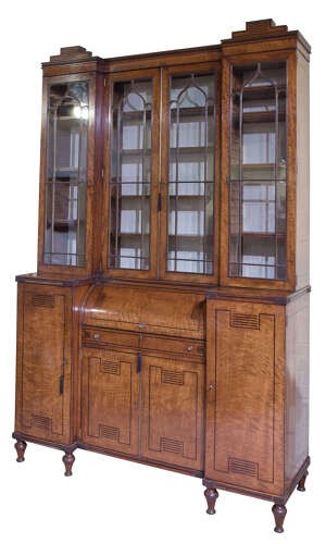 A Regency mahogany breakfront secretaire bookcase with glazed doors, satinwood veneers, and ebony inlay detail. View II