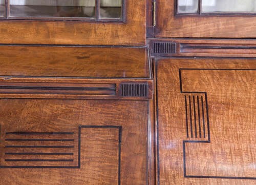 A Regency mahogany breakfront secretaire bookcase with glazed doors, satinwood veneers, and ebony inlay detail. View VI