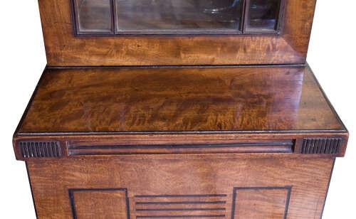 A Regency mahogany breakfront secretaire bookcase with glazed doors, satinwood veneers, and ebony inlay detail. View X