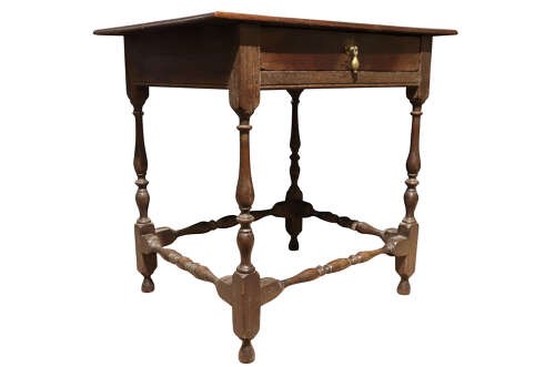 An 18th-century George II solid oak side table featuring a single drawer with a brass teardrop pull, turned legs, and stretchers. View III