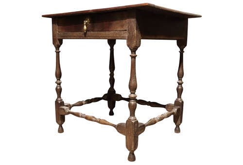 An 18th-century George II solid oak side table featuring a single drawer with a brass teardrop pull, turned legs, and stretchers. View IV