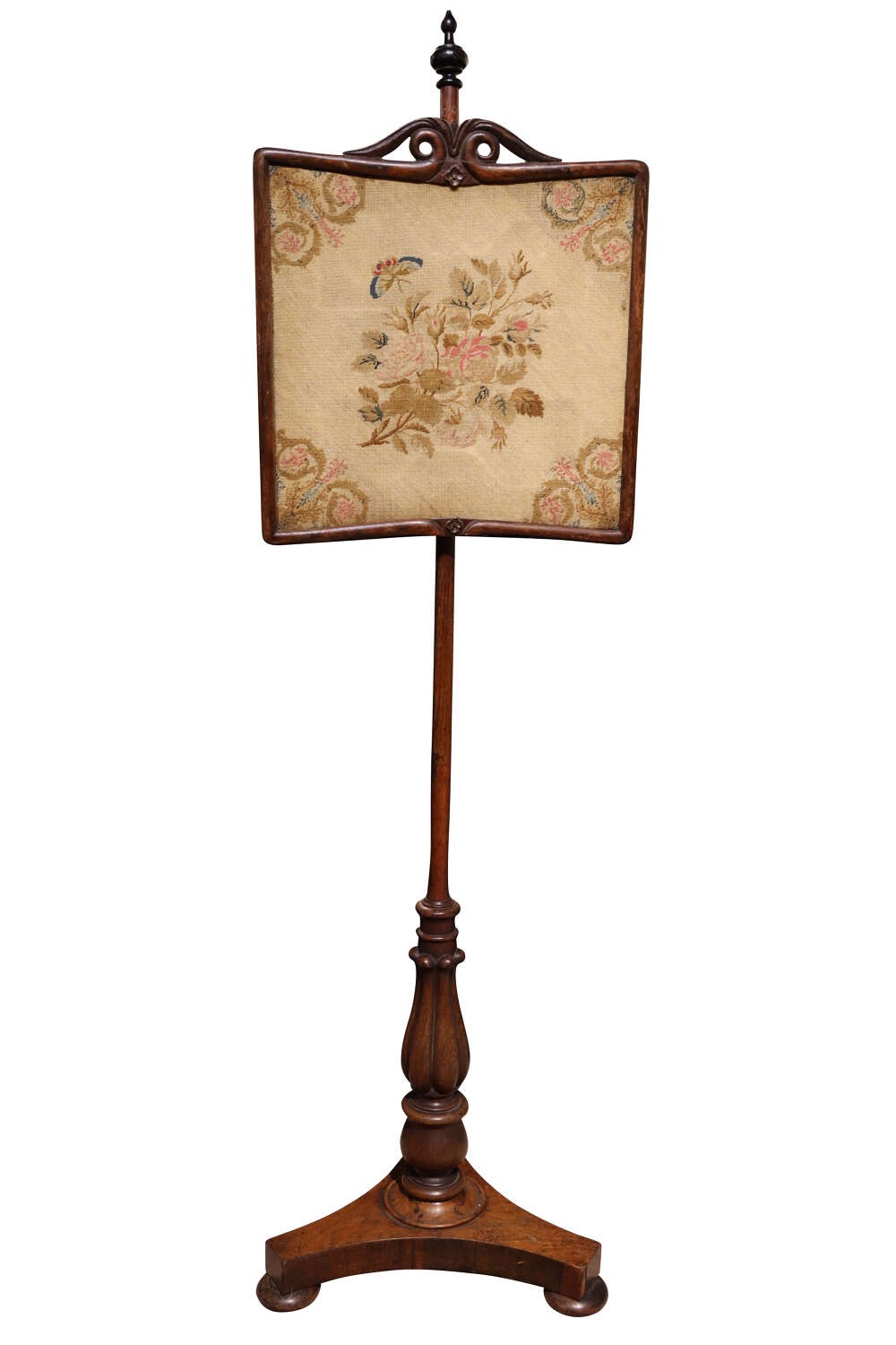 A Regency rosewood pole screen featuring an adjustable square needlework panel with floral motifs mounted on a turned column and triform base. View II