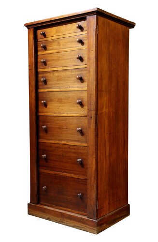 A tall mid-19th century mahogany Wellington chest featuring eight graduated drawers with turned wooden knobs and a side-locking hinged pilaster. View IV