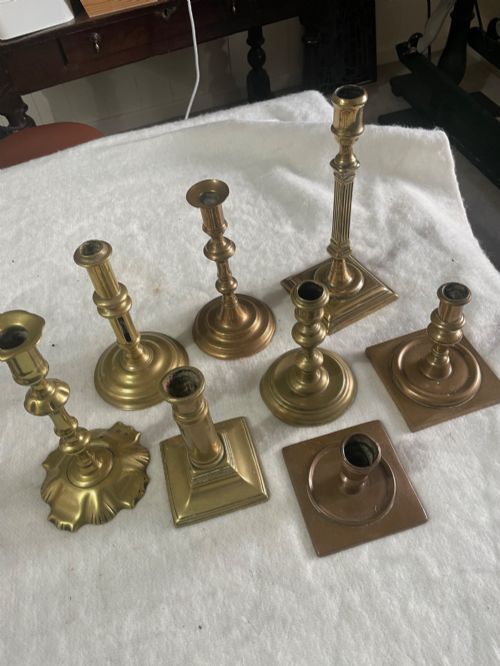 8 early brass candlesticks