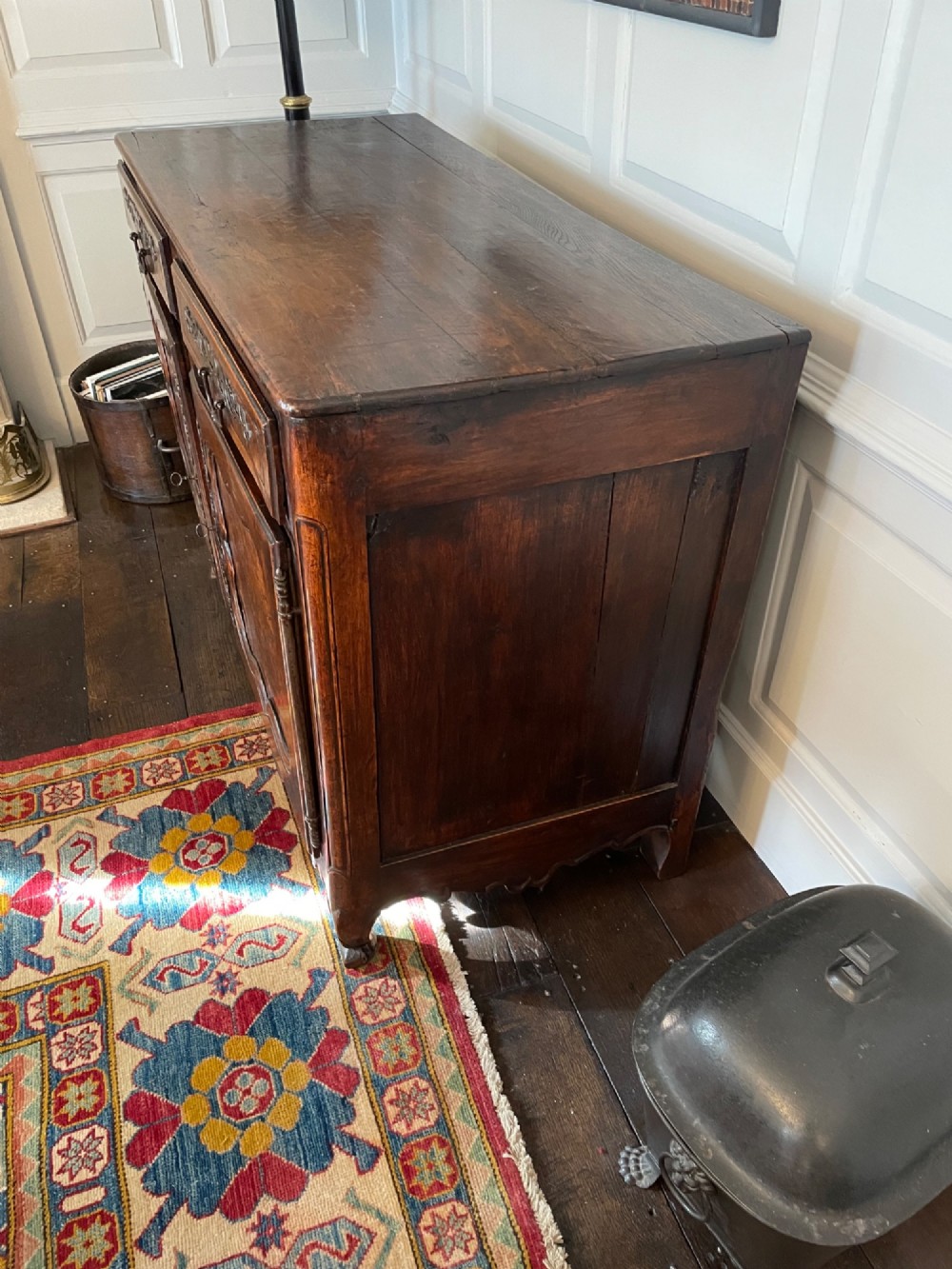An 18th-century French walnut buffet featuring two upper drawers above two moulded panel doors with brass escutcheons and a carved apron. View III