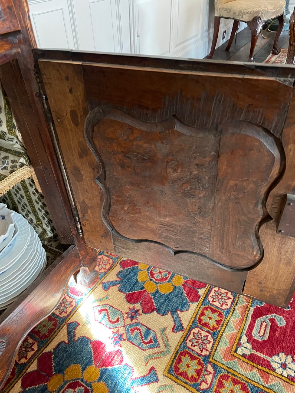 An 18th-century French walnut buffet featuring two upper drawers above two moulded panel doors with brass escutcheons and a carved apron. View VI