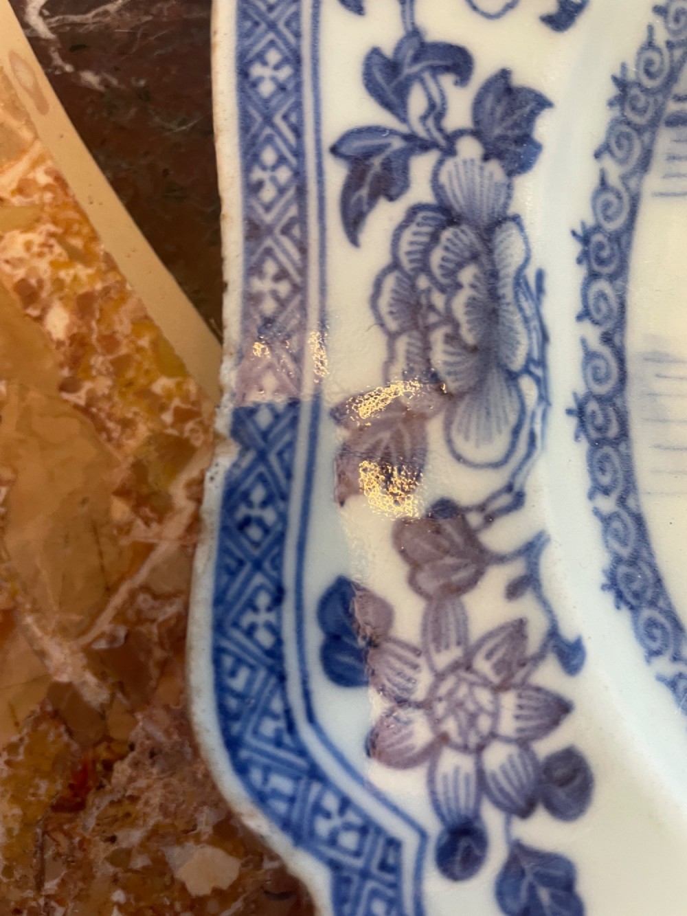 A set of five antique blue and white Chinese export porcelain oval platters with scalloped rims, featuring hand-painted landscape scenes. View IV