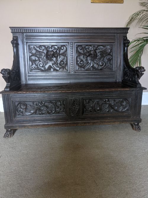 A Victorian Carved Oak Settle