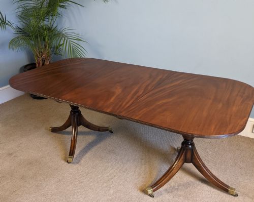 A Regency Style Mahogany Double Pedestal Dining Table.