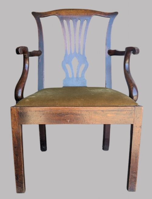 A Georgian mahogany elbow chair featuring a carved pierced back splat, curved arms, and an olive green fabric seat cushion on square legs. View II